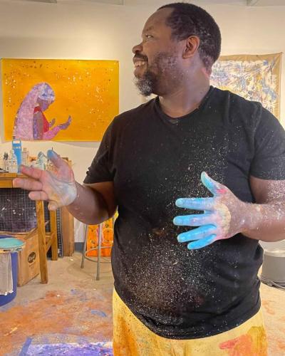Dr. Ashon Crawley covered in paint