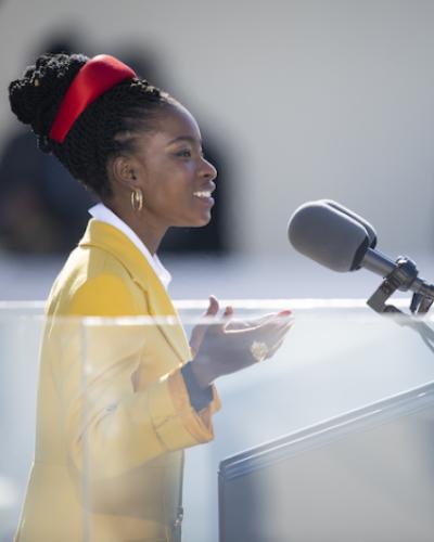 Photo of Amanda Gorman at podium, as she recites her inaugural poem, &quot;The Hill We Climb,&quot; during the 59th Presidential Inauguration ceremony in Washington, Jan. 20, 2021.