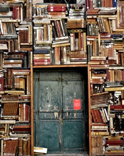 Books piled around doorway