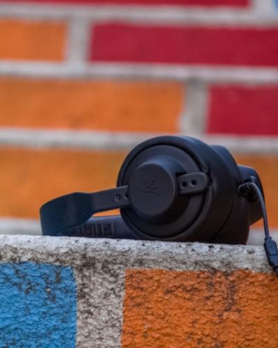 photo of headphones with colorful bricks in the background